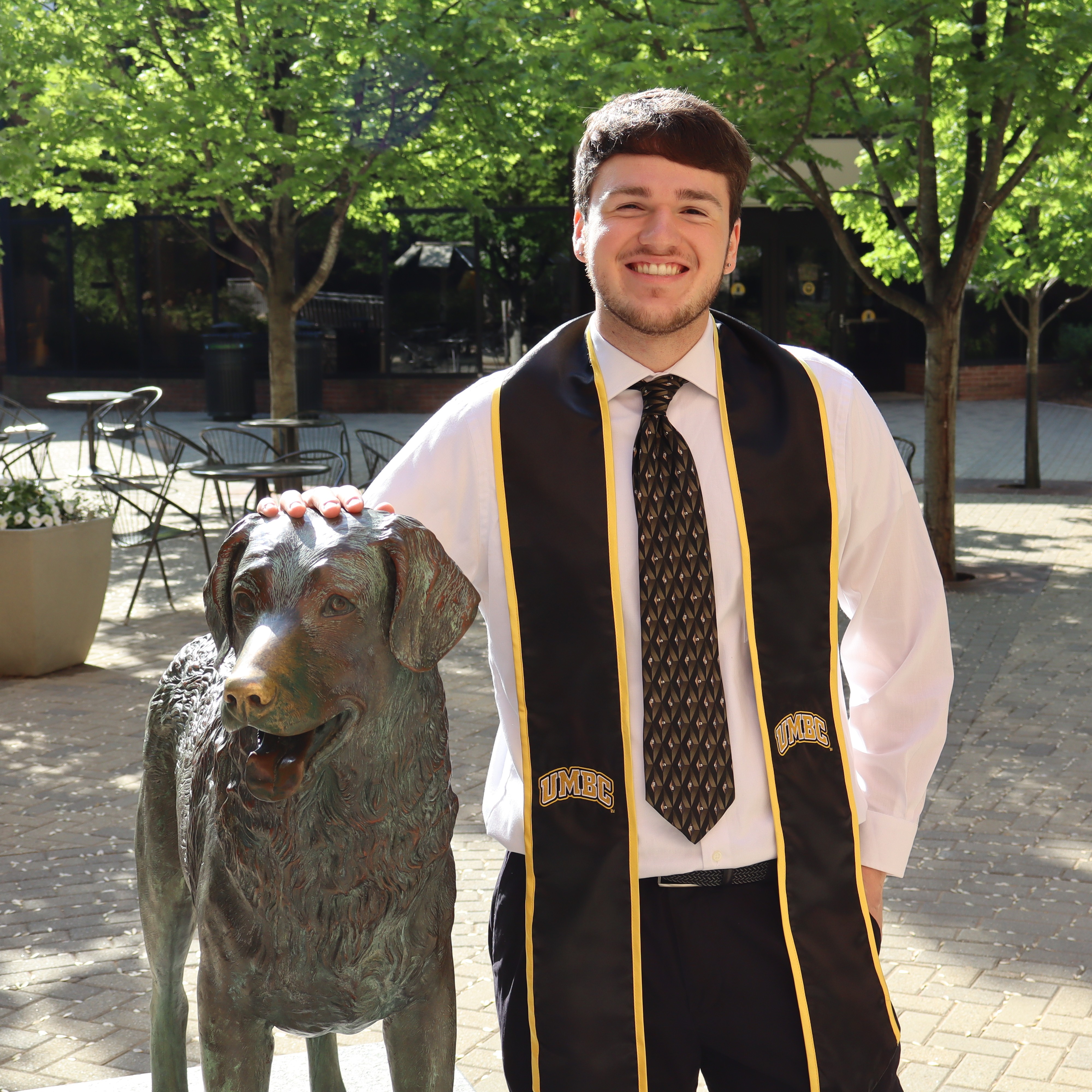 A photo of me with UMBC's True Grit statue.