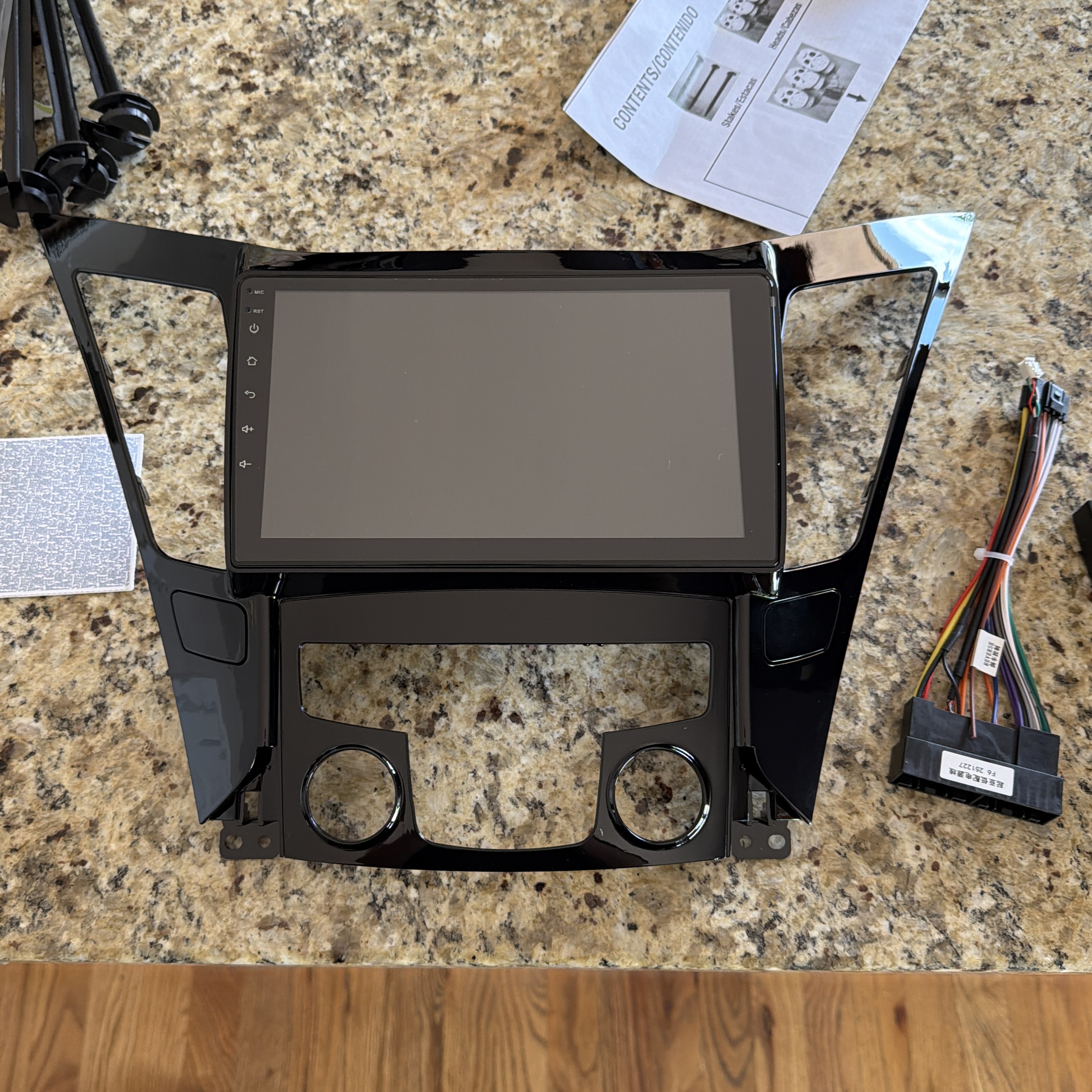 The new CarPlay unit next to the original trim.
